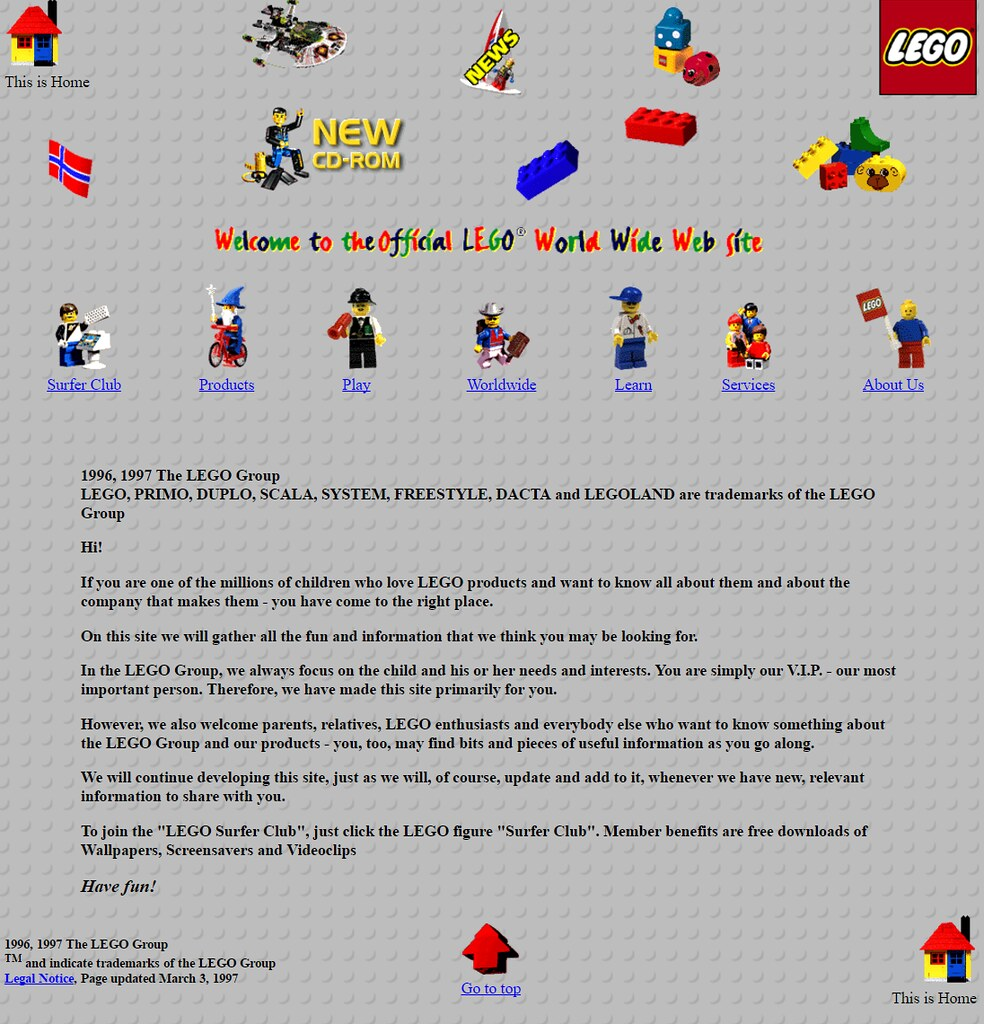 A view of the LEGO website in 1996, showing a brick pattern background and colorful LEGO characters and bricks as links and icons.
